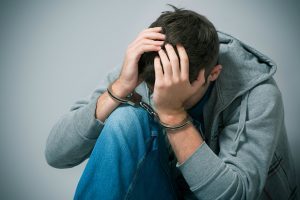 Teenager in cuffs